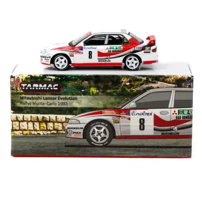 Modelo de carro Mitsubishi Lancer Evolution Rallye Monte-Carlo 1993 com várias marcas e número 8 em cima de caixa impressa.