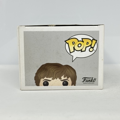Caixa Funko Pop com figura de cabelo castanho