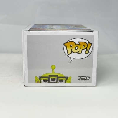 Caixa branca com imagem de alienígena verde e logo POP! Funko