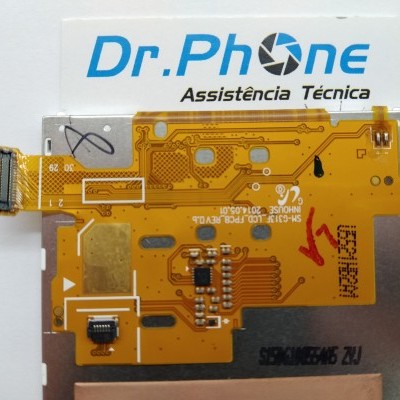 Placa eletrônica laranja com circuitos e conectores, sobre cartão branco com texto Dr.Phone Assistência Técnica