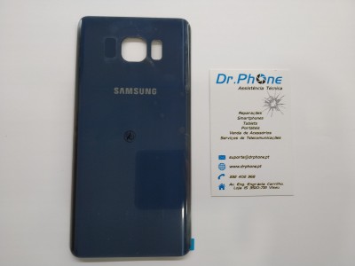 Capa traseira azul de telemóvel Samsung com cartão de visita Dr.Phone ao lado