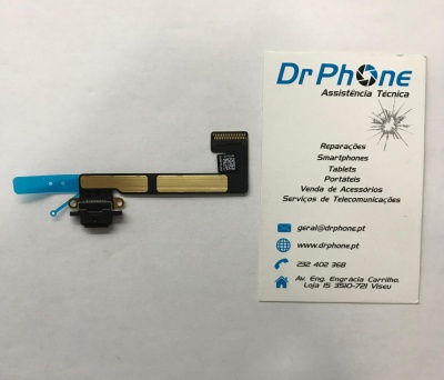 Peça eletrónica flexível preta e dourada ao lado de cartão de visita da DrPhone.