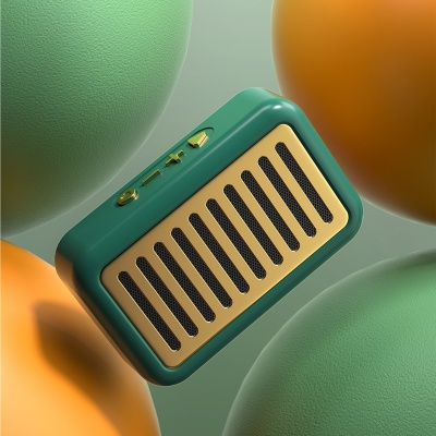 Coluna portátil verde com grelha dourada cercada por esferas coloridas