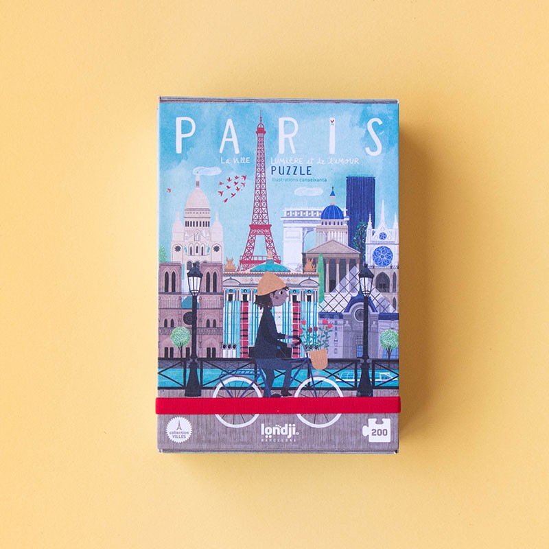 Caixa de puzzle de Paris com ilustração colorida e texto em francês