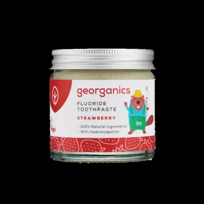 Pote de creme dentífrico de morango da georganics com rótulo colorido