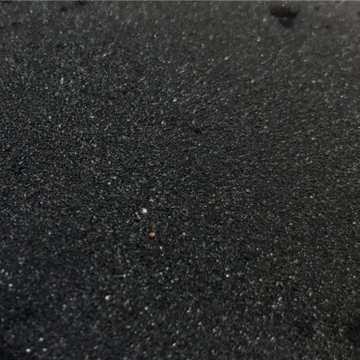 Superfície preta texturizada granulada