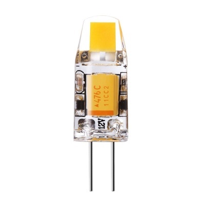 Lâmpada LED pequena com cápsula transparente e base de dois pinos.