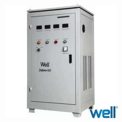 Painel elétrico cinza com botões coloridos e mostrador analógico, texto 'Well Defence 60' e logo 'well'.