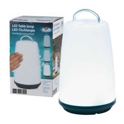 Lâmpada de mesa LED branca fosca com base preta e pega azul clara ao lado da embalagem