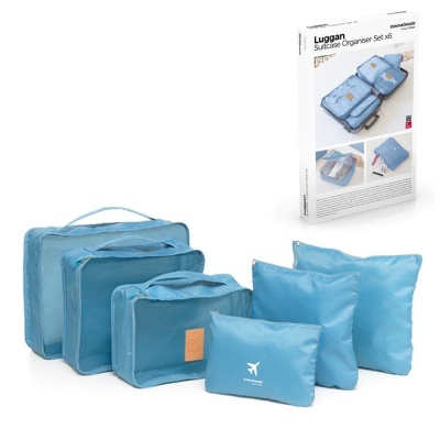 Conjunto de organizadores para mala em azul claro com embalagem e símbolo de avião.