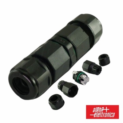 Conetor elétrico preto com várias peças desmontadas e anel verde