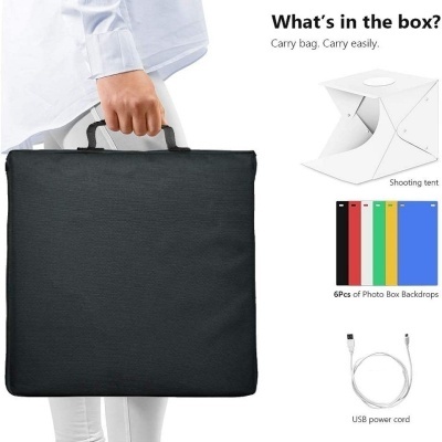 Mala preta para transporte de equipamento fotográfico com alça, ao lado imagens de tenda branca, 6 fundos coloridos e cabo USB branco