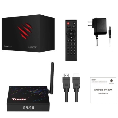 Android TV Box preto com acessórios e manual em fundo branco