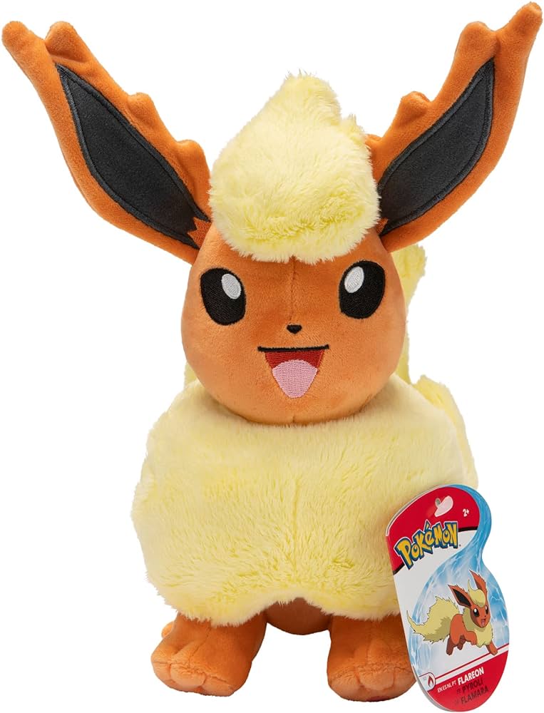 Pelúcia do Pokémon Flareon castanho e amarelo com etiqueta POKÉMON