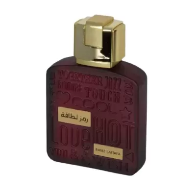 Frasco de perfume vermelho escuro com tampa dourada e texto em relevo