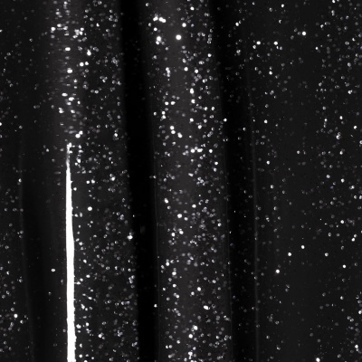 Tecido preto com brilho metálico prateado irregularmente espalhado