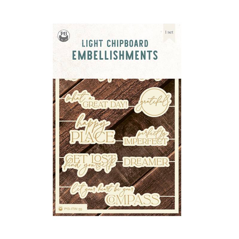 Conjunto de decorações em chipboard com frases em inglês em embalagem sobre fundo de madeira escura