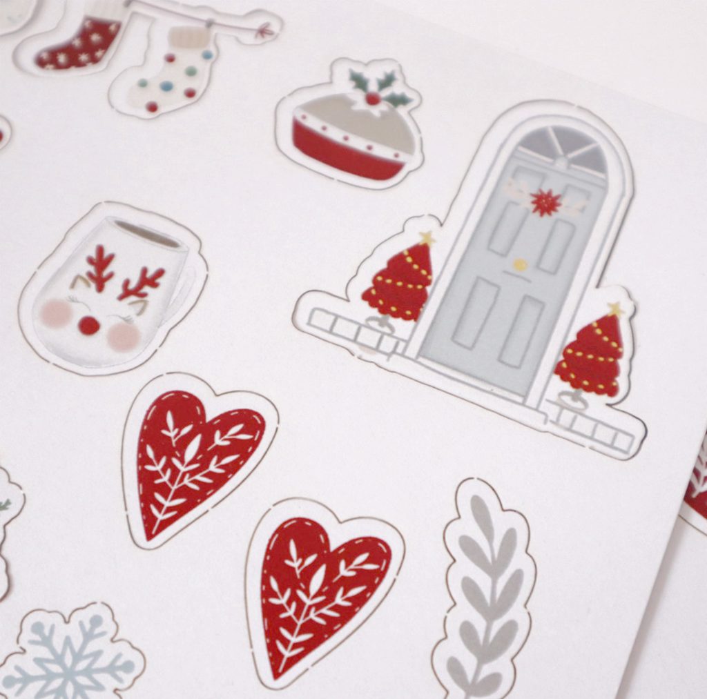 Autocolantes natalícios com desenhos coloridos sobre fundo branco