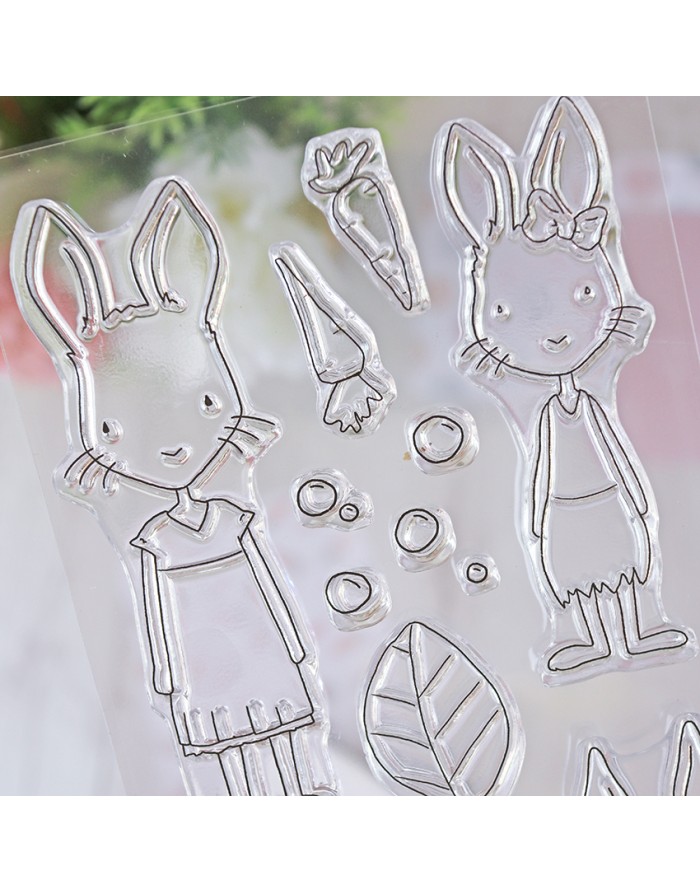 Conjunto de carimbos transparentes com desenhos de coelhos e elementos da natureza