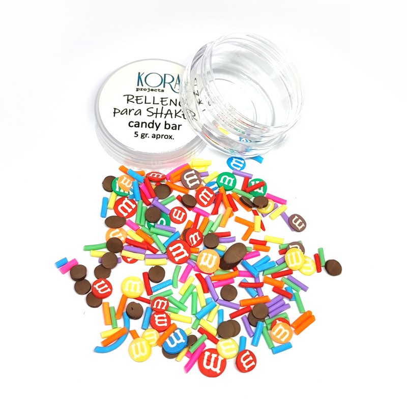 Frasco aberto com decorações coloridas para unhas tipo confeites M&M's