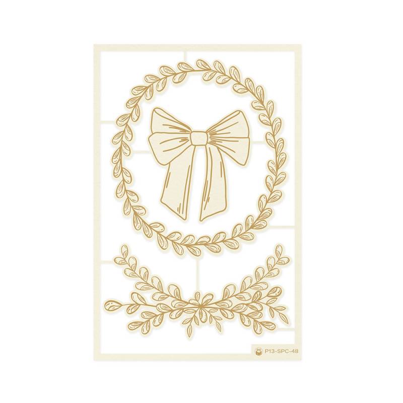 desenhos dourados de laço e folhas em fundo branco