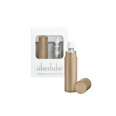 Frasco dourado de spray com estojo branco de embalagem e texto sobre lubrificante.