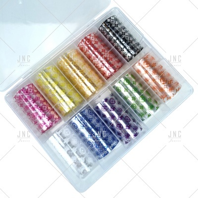 Conjunto de rolos de fita adesiva colorida com padrões florais organizados em caixa transparente