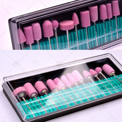 Conjunto de pontas de polimento cor-de-rosa em caixa transparente com base verde