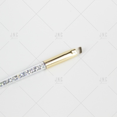 Pincel de maquilhagem com cabo transparente decorado e cerdas curtas anguladas