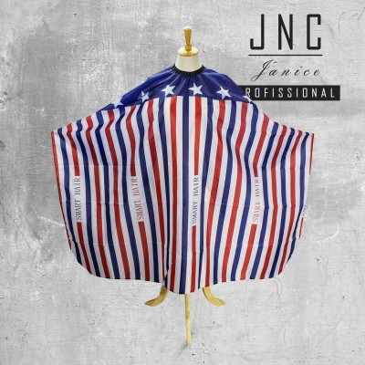 Capa para corte de cabelo com riscas vermelhas, brancas e azuis e estrelas brancas