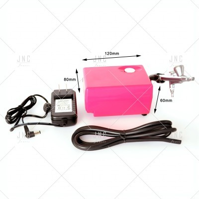 Kit de aerógrafo com compressor rosa, alimentador elétrico preto e pistola prateada com cabo preto