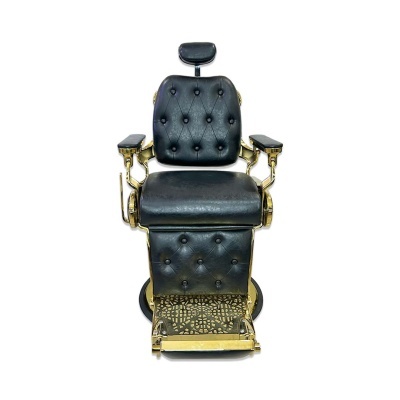 cadeira de barbeiro em couro preto com estrutura dourada