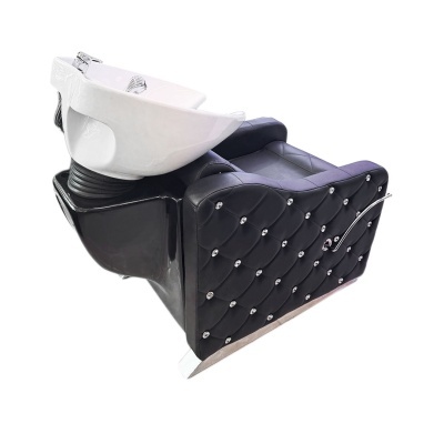 cadeira lavatório preta acolchoada com cuba branca e misturador