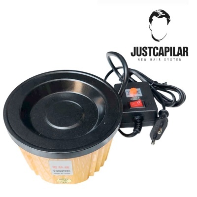 Aparelho eléctrico capilar cilíndrico amarelo com tampa preta e cabo com interruptor