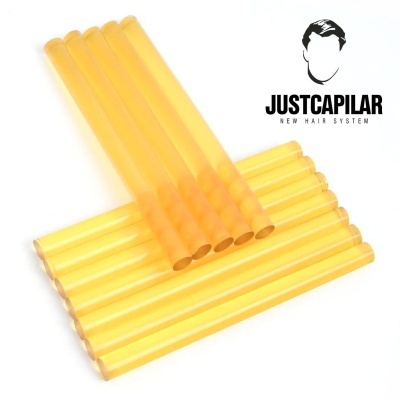 Bastões de cola quente amarelos e logotipo JUSTCAPILAR NEW HAIR SYSTEM