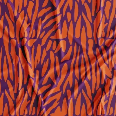 Tecido com padrão zebrado castanho e alaranjado com vincos