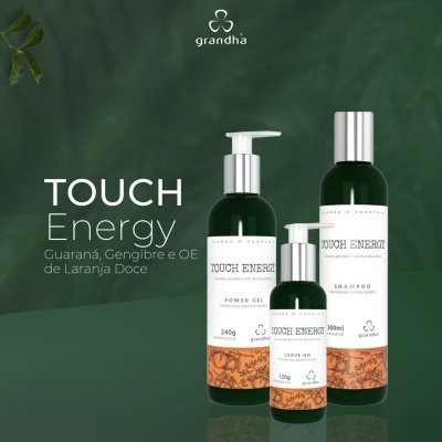 Produtos de cuidado pessoal Grandha TOUCH Energy com embalagens verdes e rótulos brancos com detalhes laranja