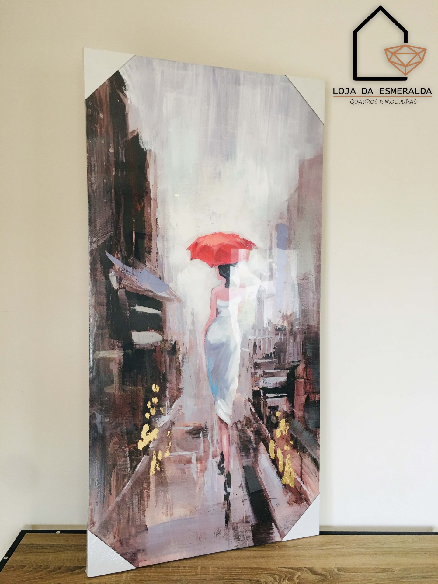 Quado decorativo com pintura de mulher com guarda-chuva vermelho em cidade abstrata
