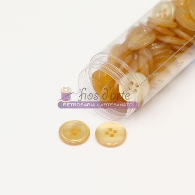 Frasco com botões amarelos translúcidos