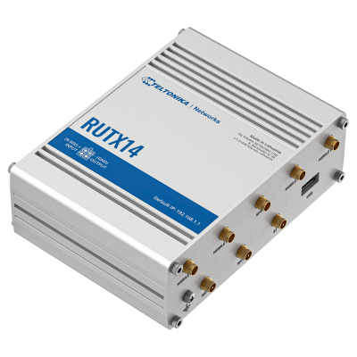Dispositivo eletrônico RUTX14 prateado com portas coaxiais douradas e rótulo azul