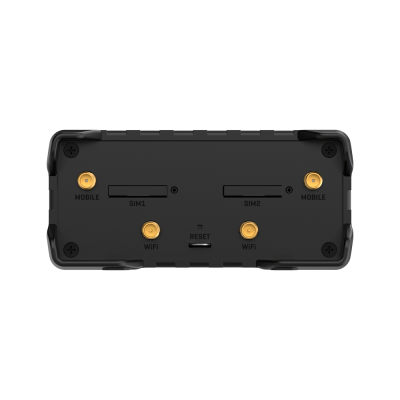 Parte traseira de dispositivo preto com entradas para antenas e slots SIM.