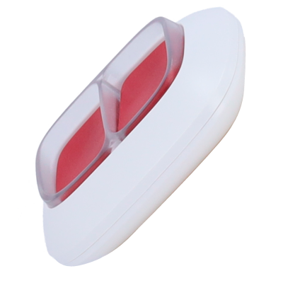 Caixa branca com dois comprimidos cor de rosa dentro de tampa transparente