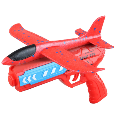 Brinquedo pistola vermelha com avião vermelho e azul