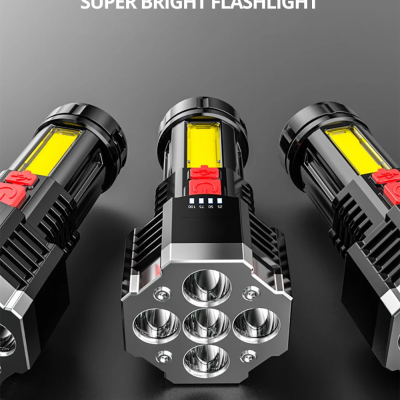 Três lanternas super brilhantes pretas com detalhes amarelos e vermelhos sobre fundo cinza