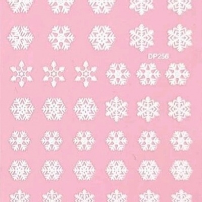 Autocolantes brancos de flocos de neve em fundo rosa