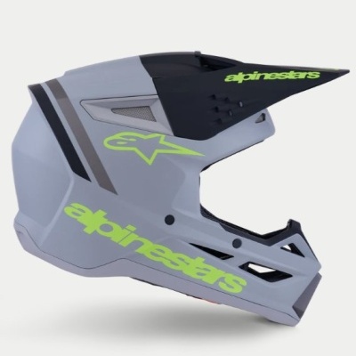 Capacete de motocross cinzento e preto com texto verde neon alpinestars