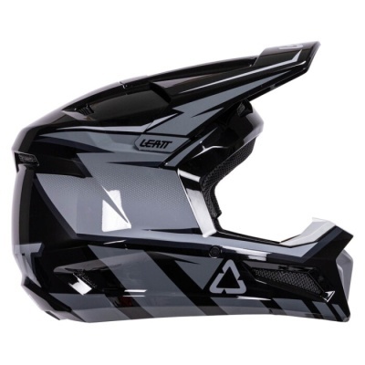 Capacete integral preto e cinza com padrões geométricos e texto LEATT