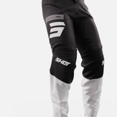 Calças de motocross pretas e brancas com logótipo SHOT e gráficos