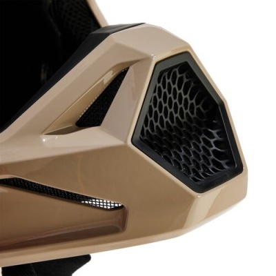 Close-up de peça plástica bege com padrão hexagonal preto