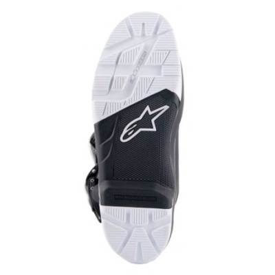 Sola de bota desportiva preta e branca com logótipo Alpinestars
